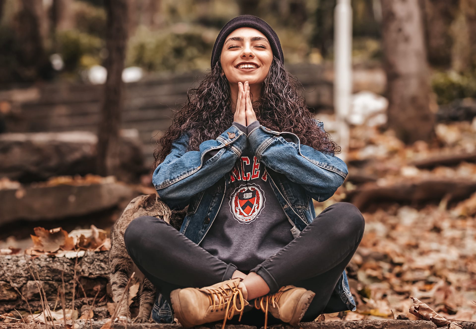 girl practicing meditating with a smile on her face